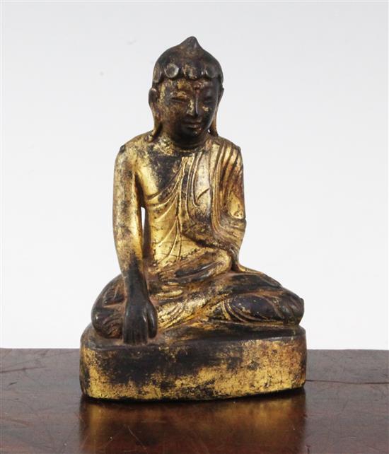 A Burmese gilt, composite and wood seated figure of Buddha, 19th century or later, 15.3cm